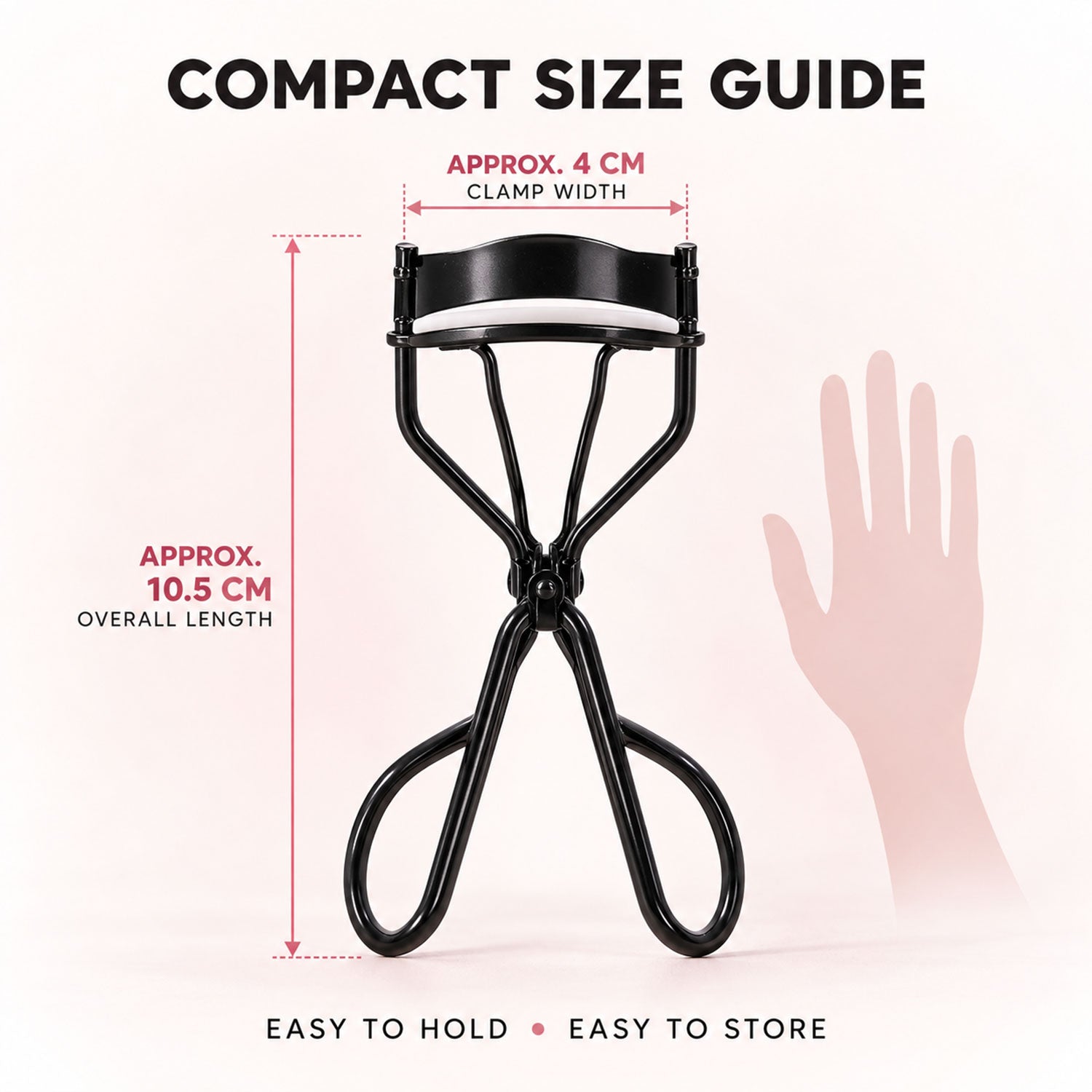 A black eyelash curler with a white pad, showing its approximate 4 cm clamp width and 10.5 cm overall length next to a hand