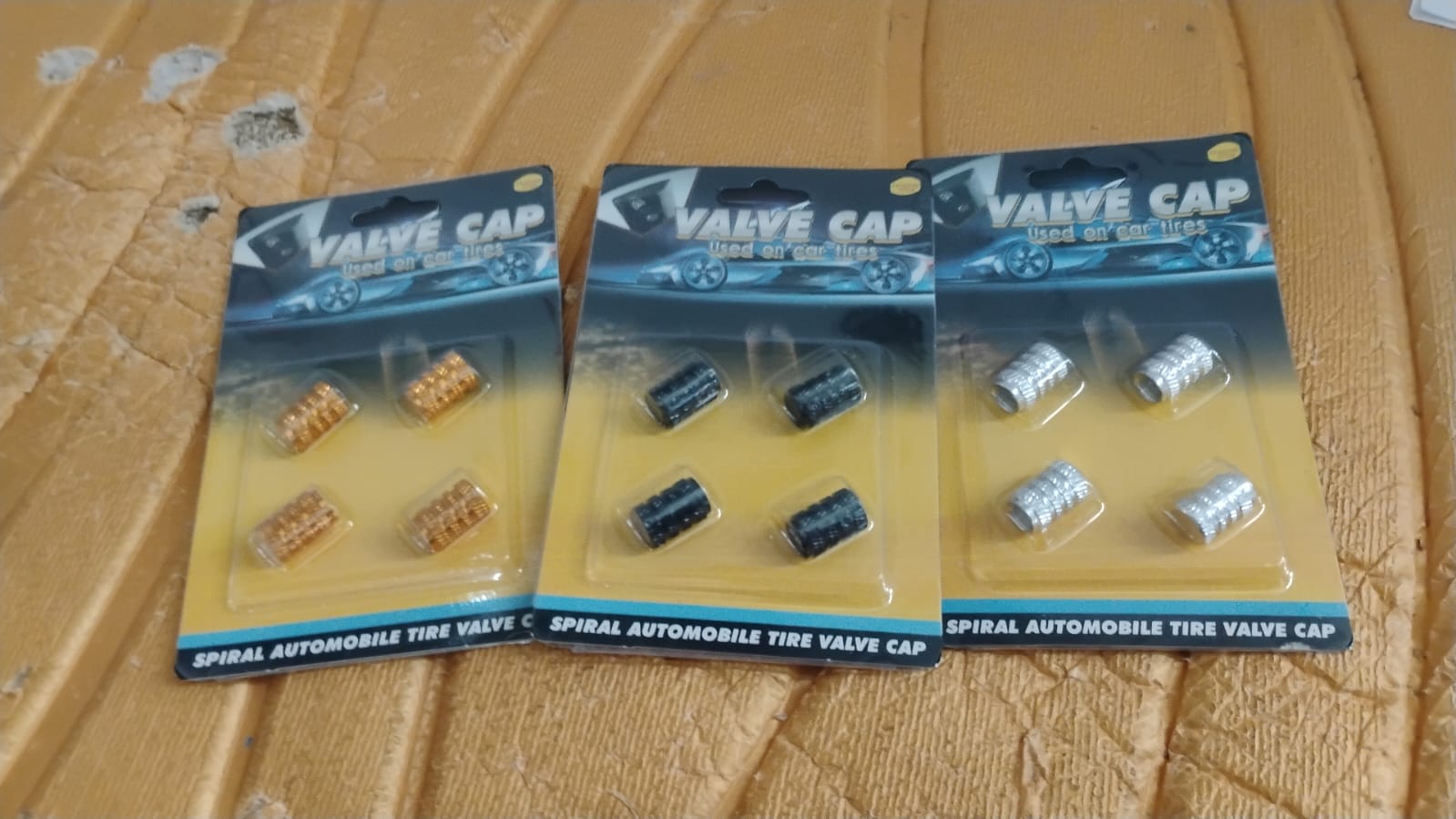 Silver aluminium valve stem cap on smooth surface