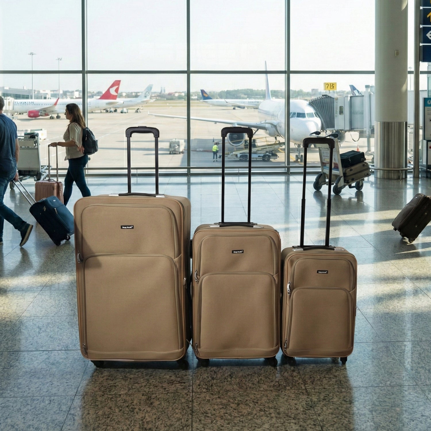 Side view of 3-piece luggage set in brown shade