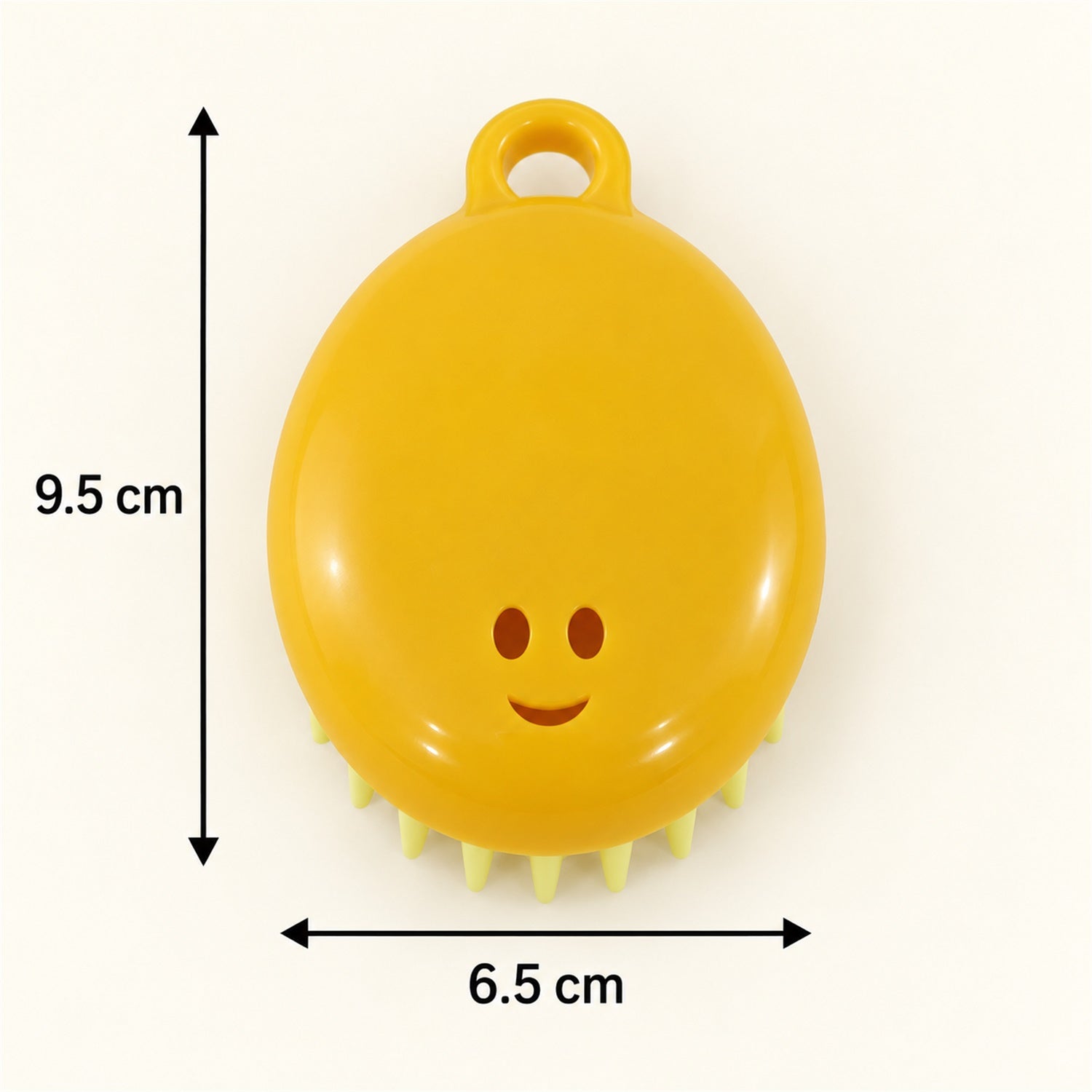 A yellow silicone scalp brush with light green bristles is displayed with measurements of 9.5 cm and 6.5 cm.