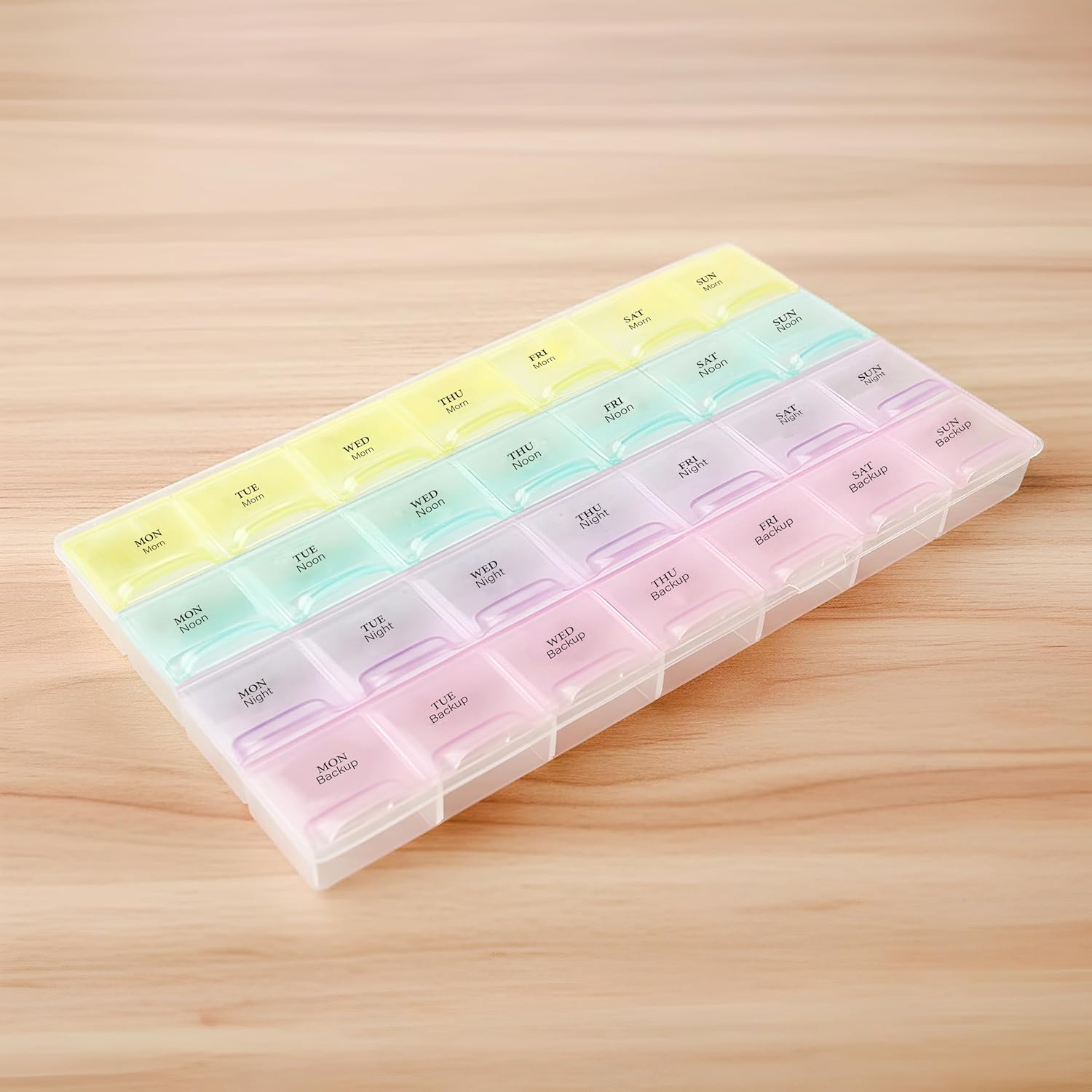 Portable pill organizer with clear compartments and easy-open lids
