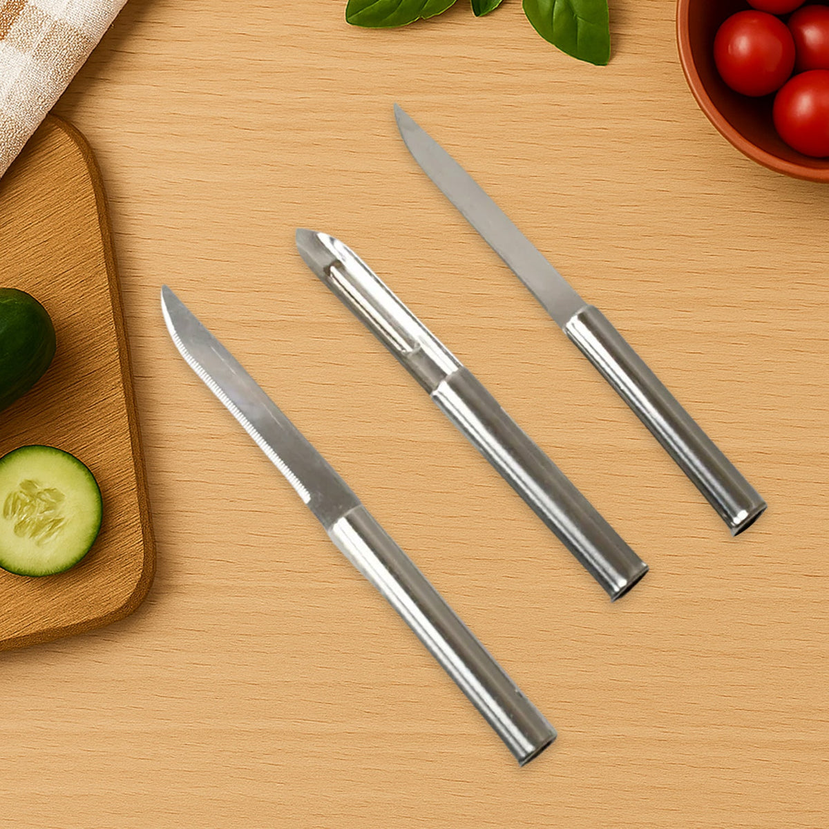 Cisora 3-piece stainless steel kitchen knife set laid out on white background