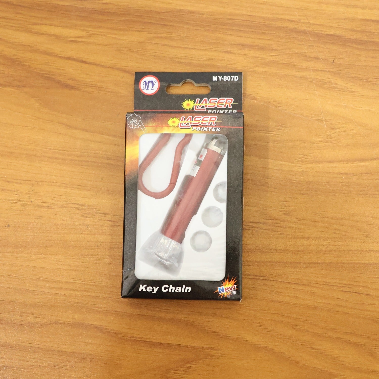 Compact 4-in-1 laser light tool alongside keychain