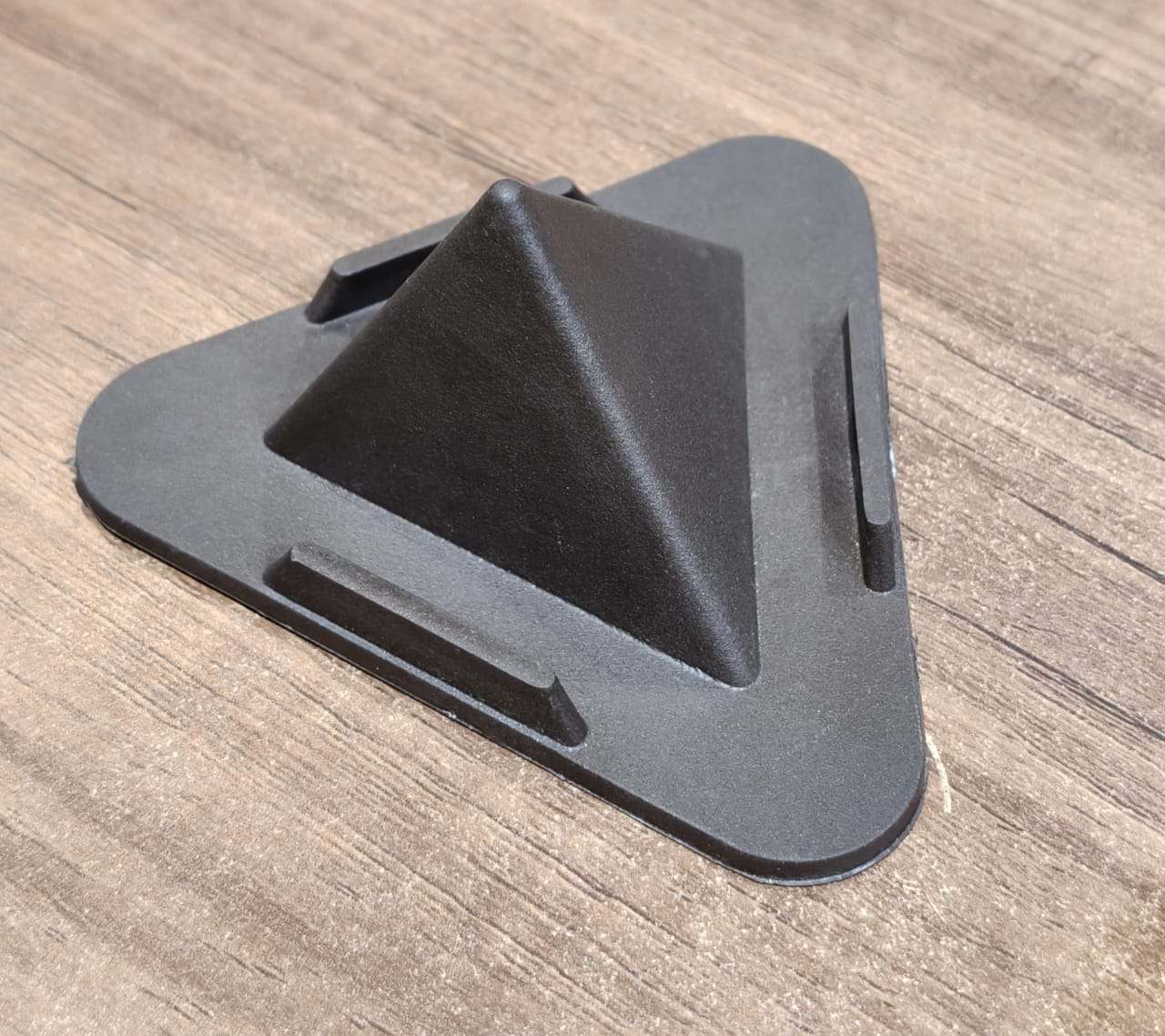 Brown Pyramid Mobile Stand on table with phone