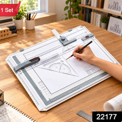 A person's hand uses a pencil to draw on a white A3 drawing board with various rulers and tools.