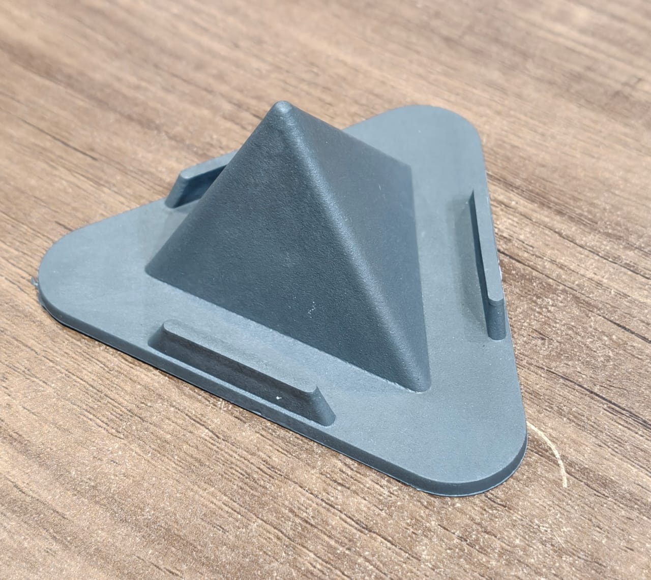 Grey Pyramid Mobile Phone Stand on desk