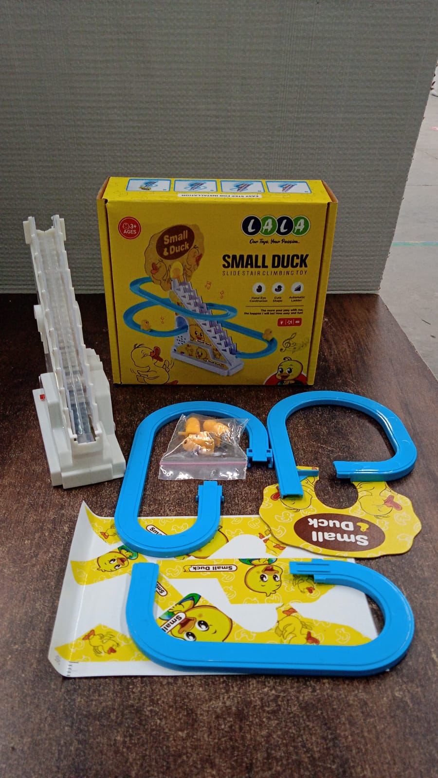 Small duck toy on staircase track