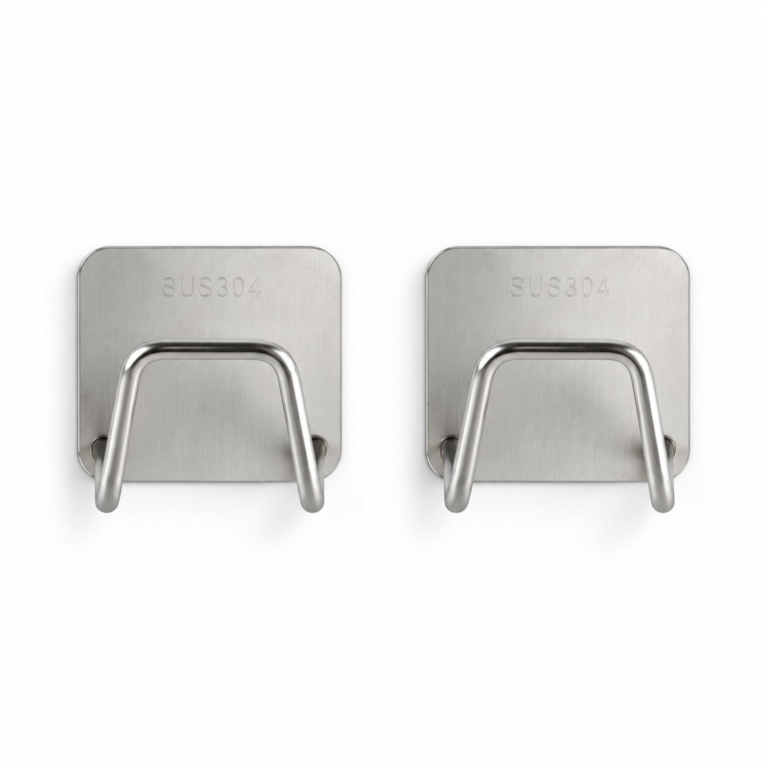 Two identical rectangular brushed stainless steel sponge holders with curved wire frames are displayed on a white background.