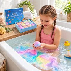 A child in a pink swimsuit holds a colorful bath bomb, creating a rainbow fizz in the bathtub next to a toy boat.