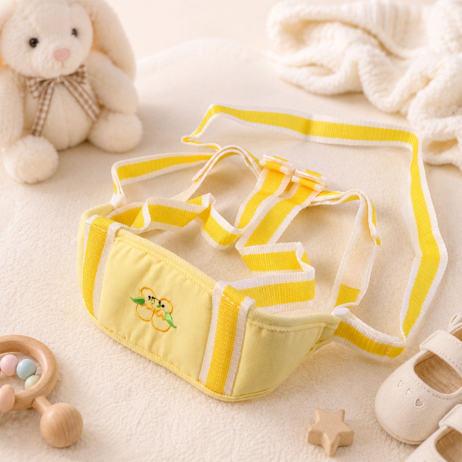 Toddler using baby walking harness for indoor support, soft padded waist in yellow