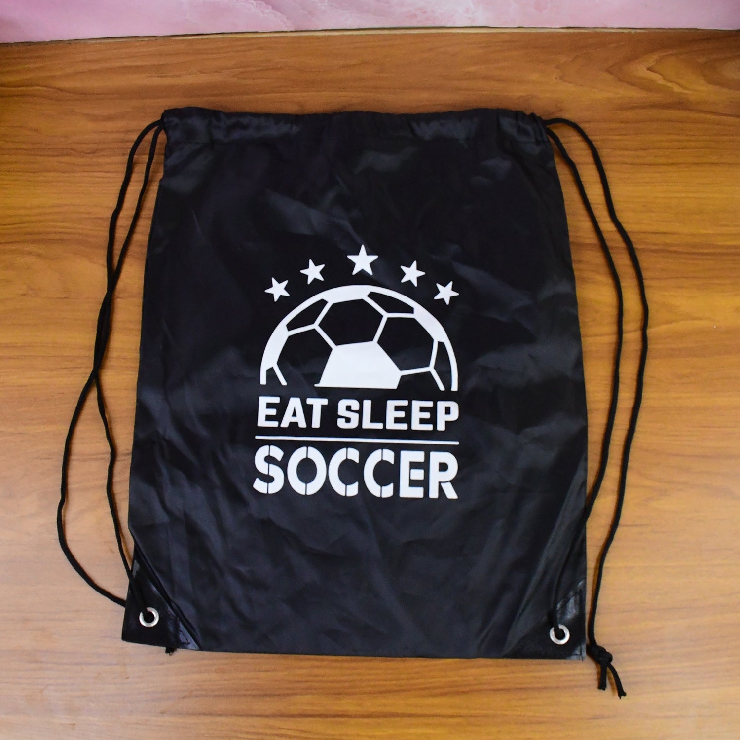 Drawstring sport backpack on floor