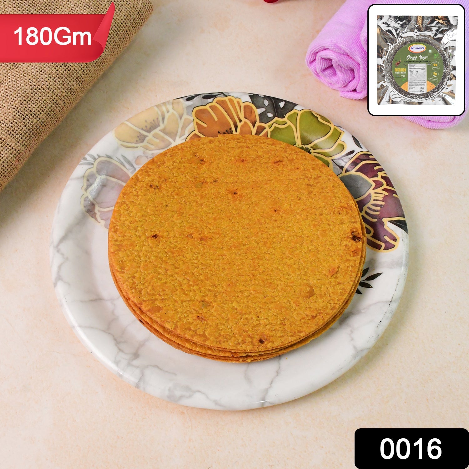 Maniarr's Gingy Bajri Khakhra packet with product pieces, highlighting branding.