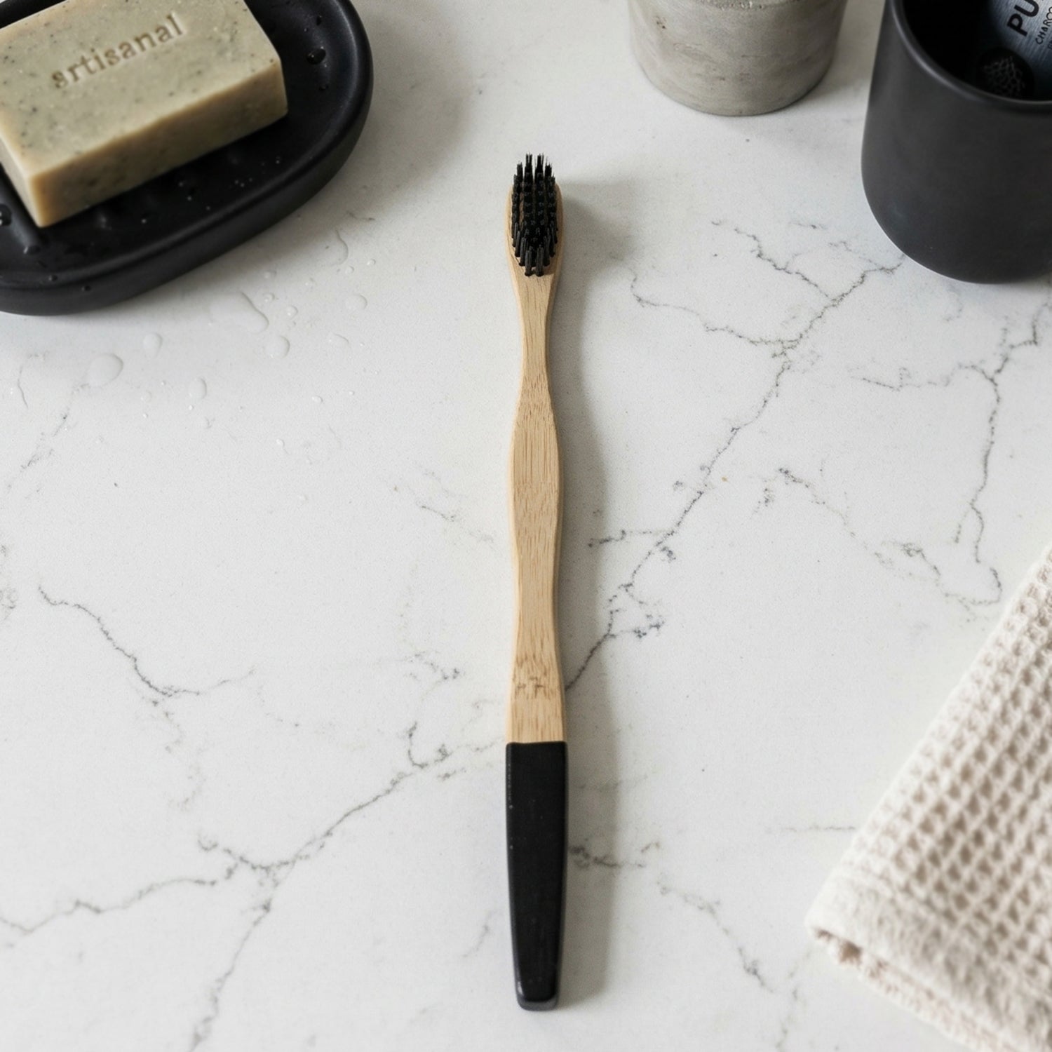 Bamboo toothbrush angled view showing charcoal bristles