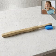 Wooden toothbrush with soft blue bristles