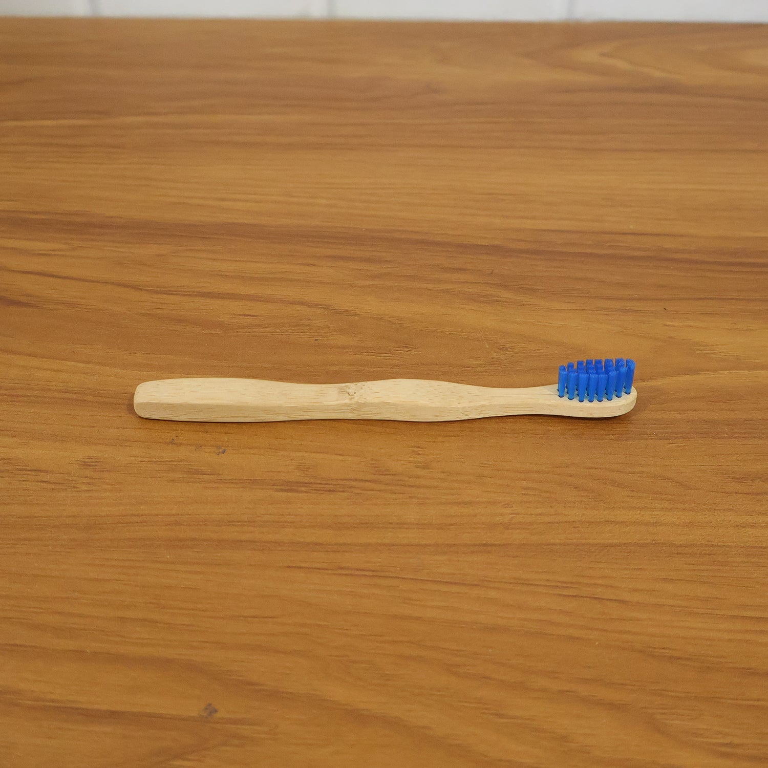 Wooden toothbrush in natural setting