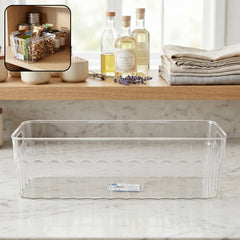 Transparent plastic fridge organizer basket with handles for easy lifting.