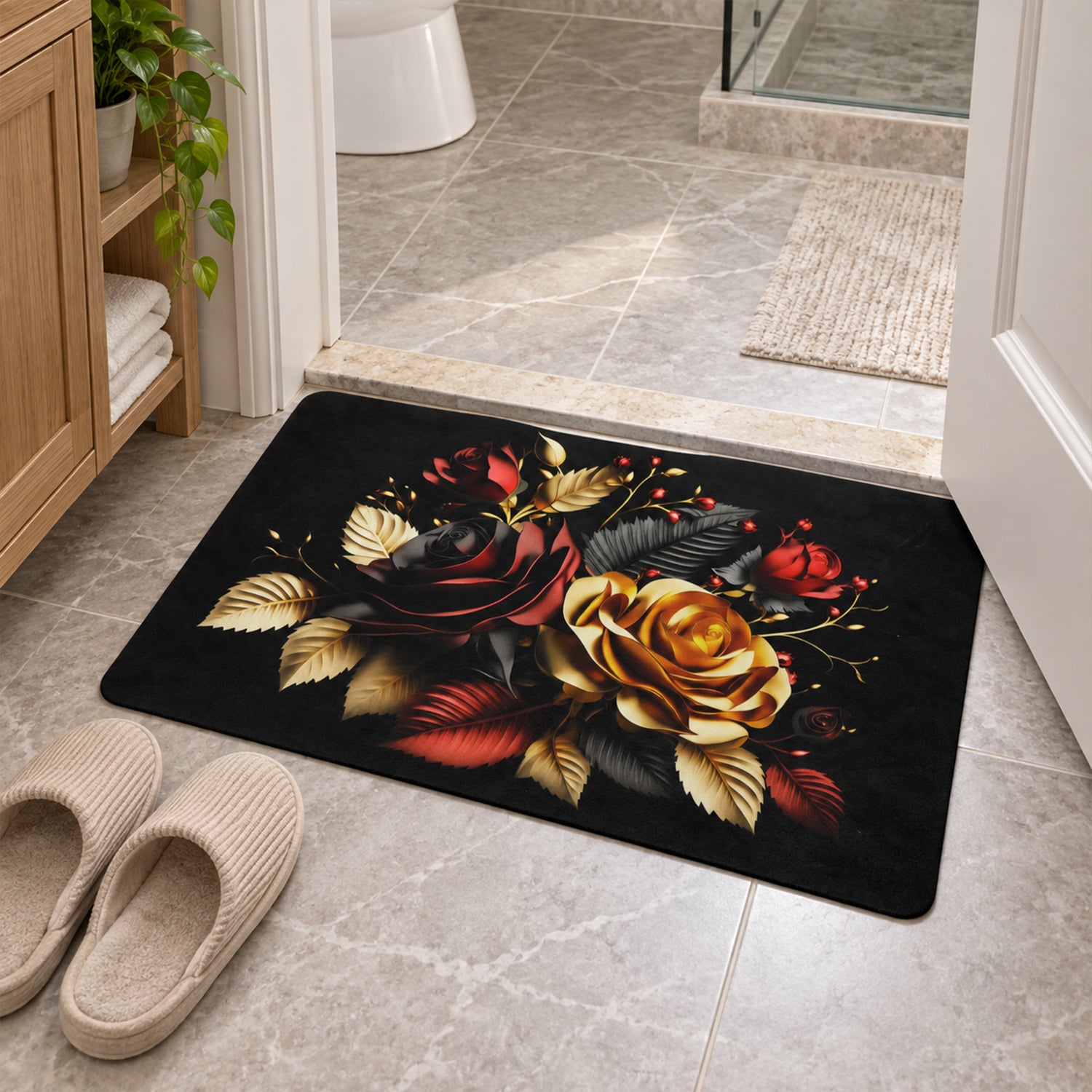 A black bath mat with a red and gold rose pattern sits on a tiled bathroom floor next to a pair of slippers.