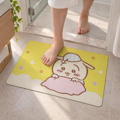 A person's bare feet step onto a yellow bath mat with a cute cartoon bunny wearing a striped nightcap.