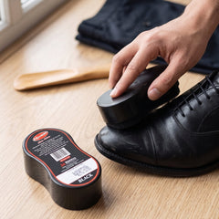 Black shine shoe polish with sponge