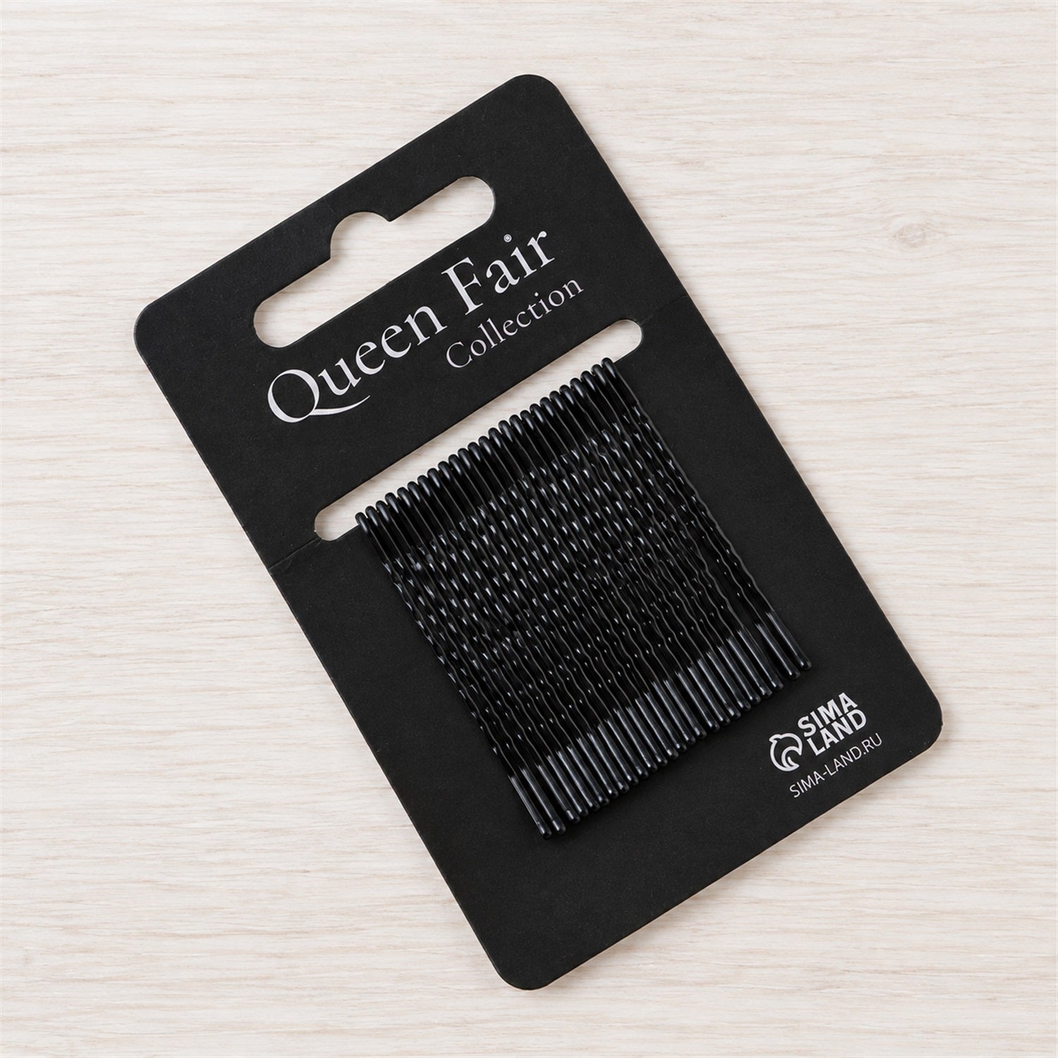 Pack of black metal bobby hair pins for styling