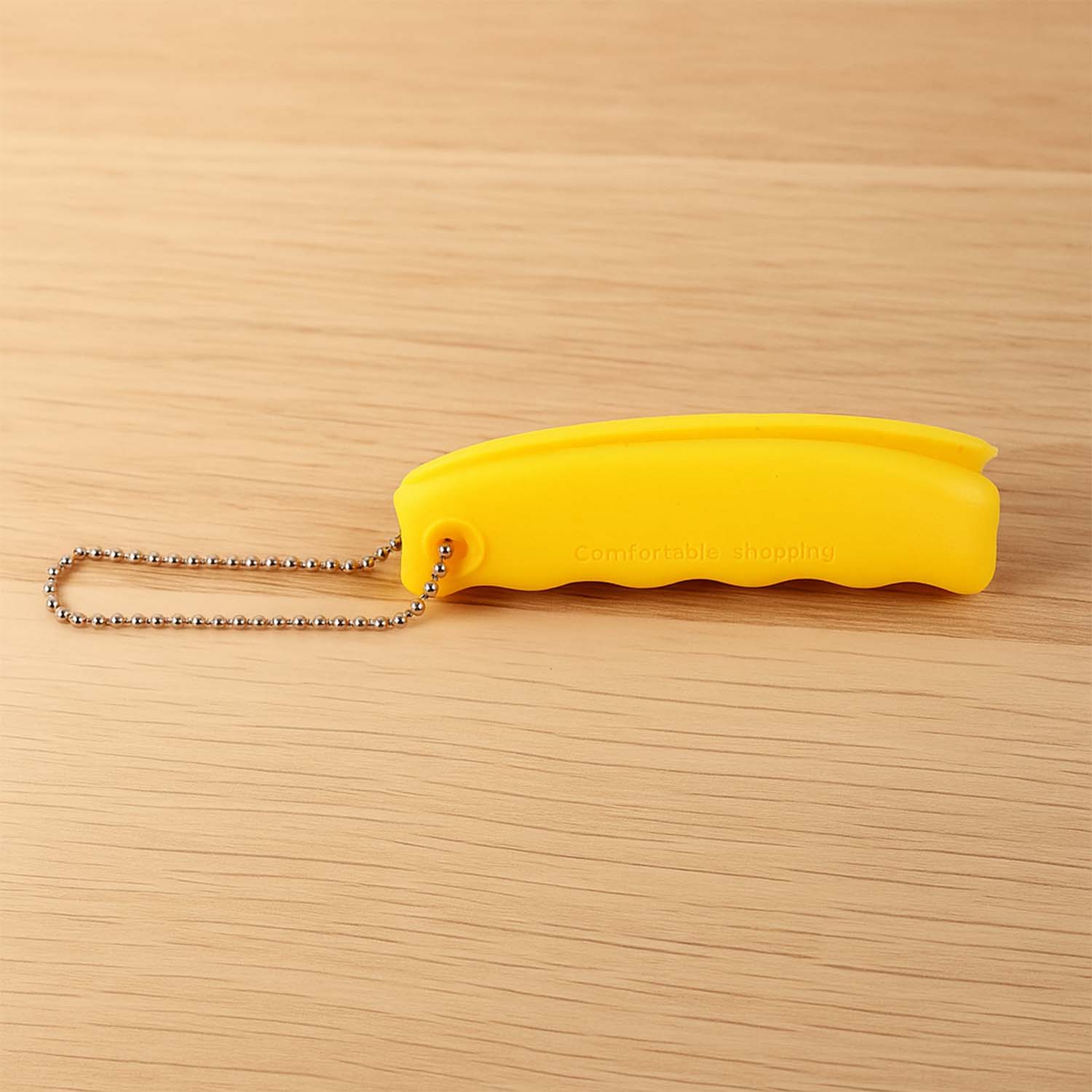 Silicone bag holder attached to a keyring