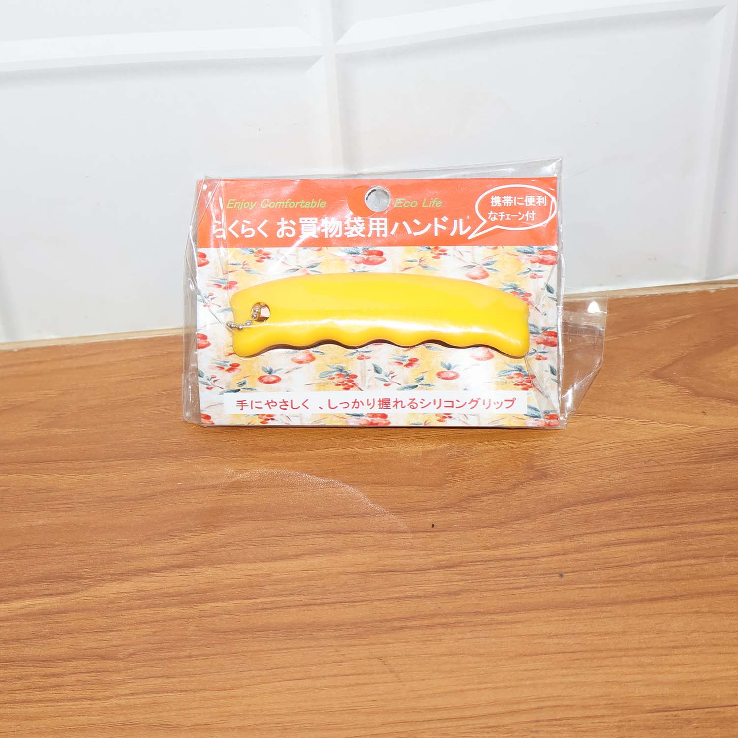 Person using silicone bag carry tool for groceries