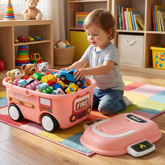 A toddler sits on a colorful rug, placing a blue car toy into the pink fire truck storage box filled with other toys.