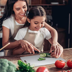 Close-up of stainless steel vegetable and fruit cutting board