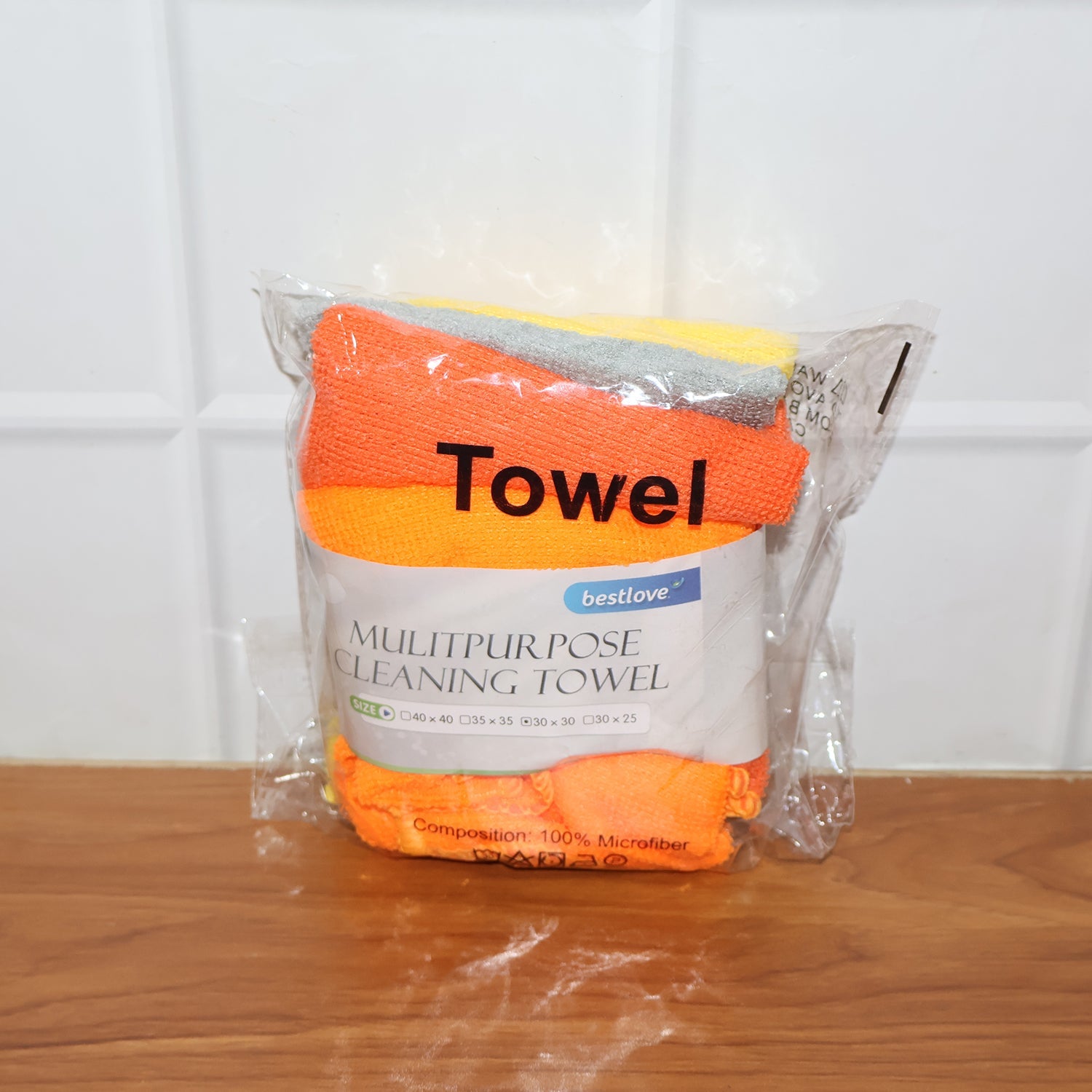 Microfiber cloth in use cleaning a kitchen counter