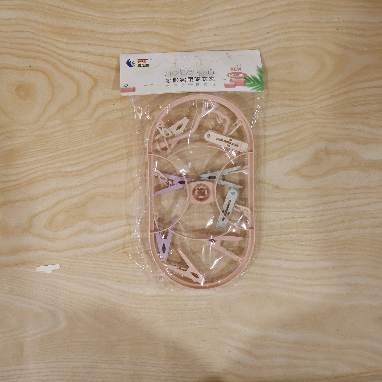 Packaging image of set of multipurpose plastic hanger clips ready for household use
