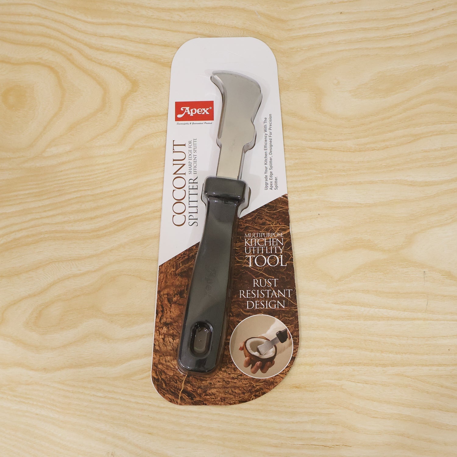 The Apex coconut splitter tool in its retail packaging, featuring product details and an image of the tool in use.