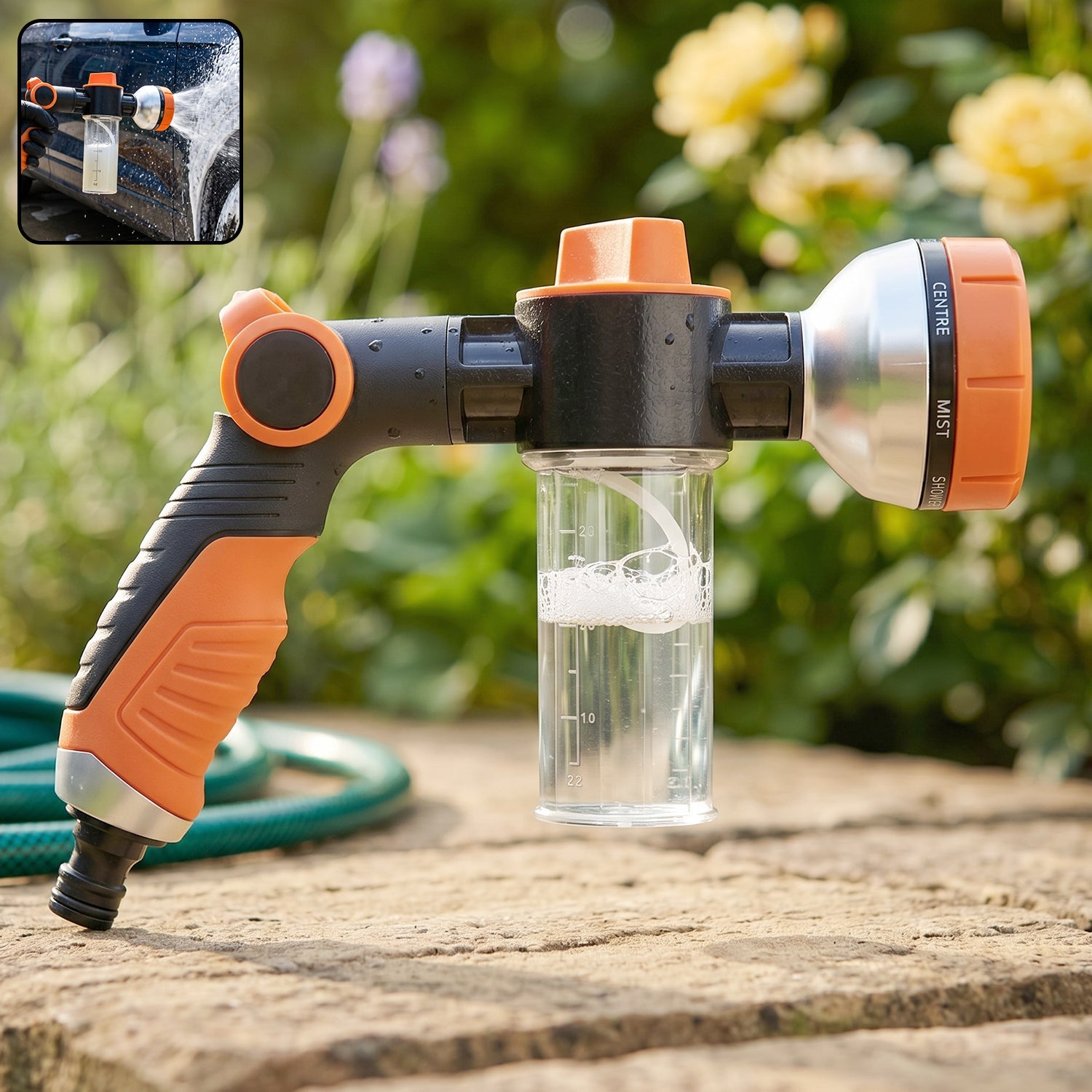 Close-up view of the handheld adjustable hose spray nozzle with foam bottle.
