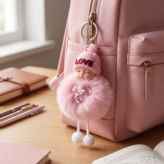 Cute doll plush keychain showing key ring attachment