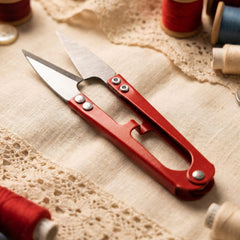 Compact sewing scissors for precise thread cutting