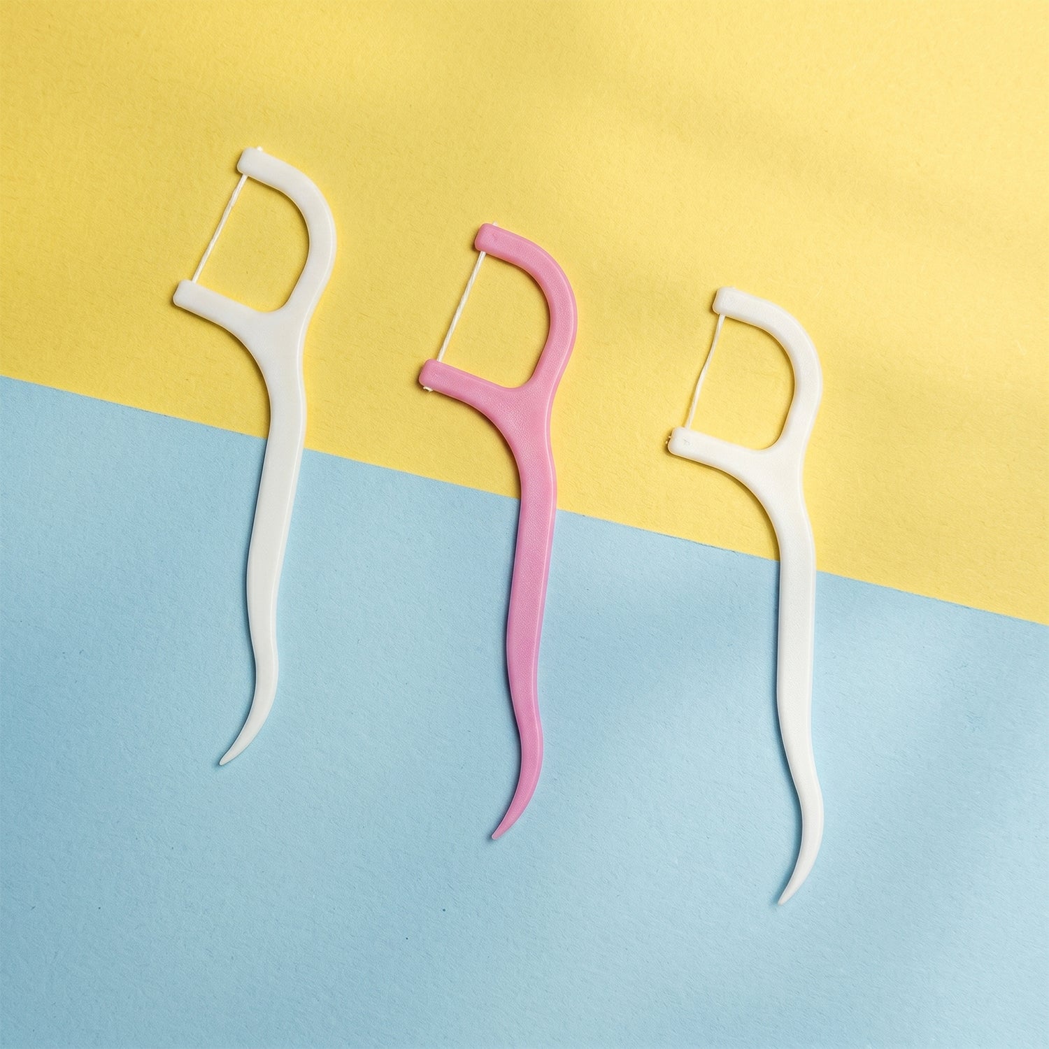 Set of floss picks highlighting ease of use during travels