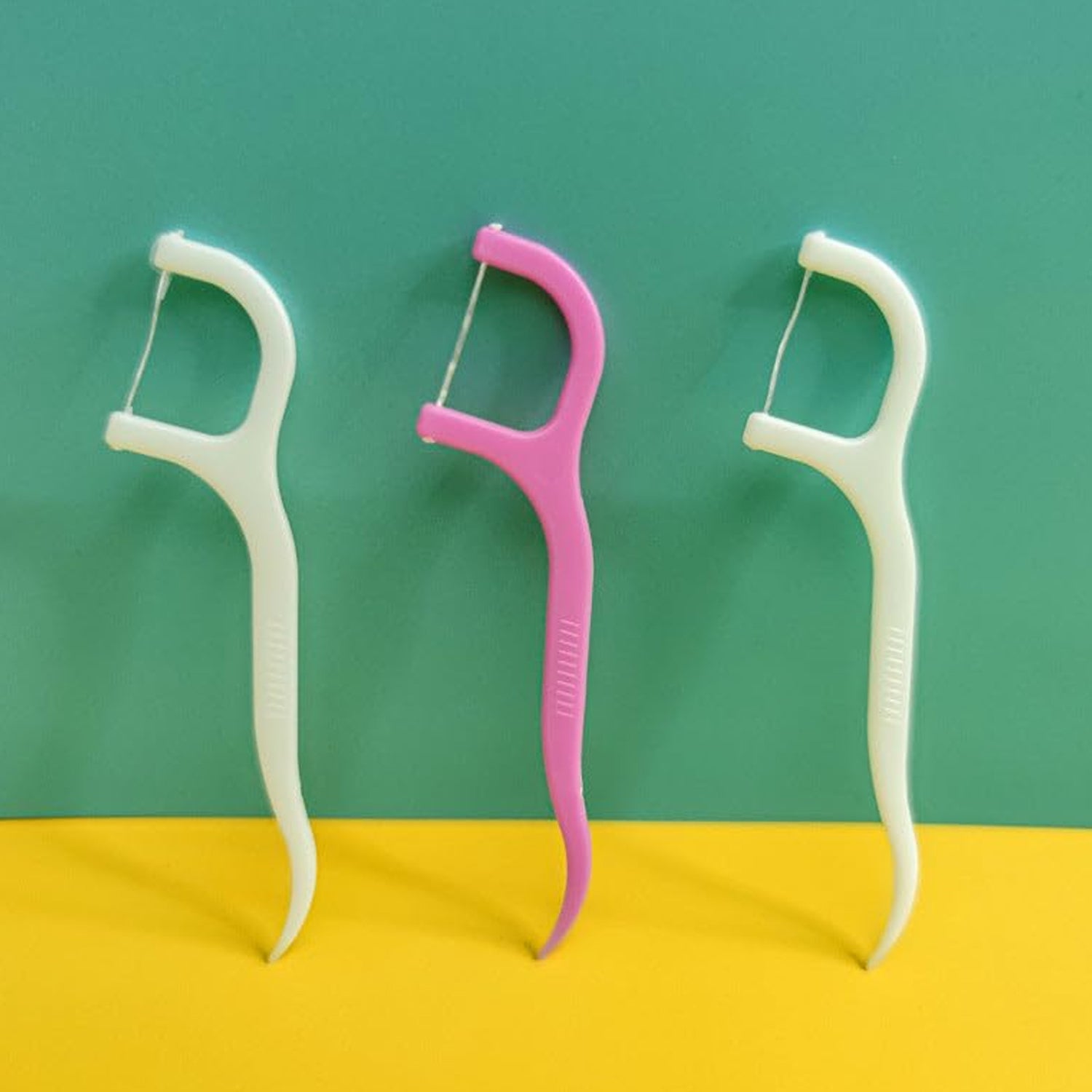 Set of disposable oral care interdental flossers in assorted colors