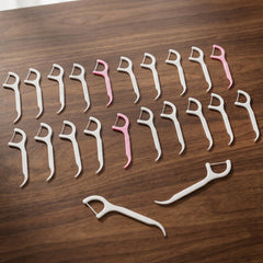 Portable dental floss picks in a travel bag and office environment