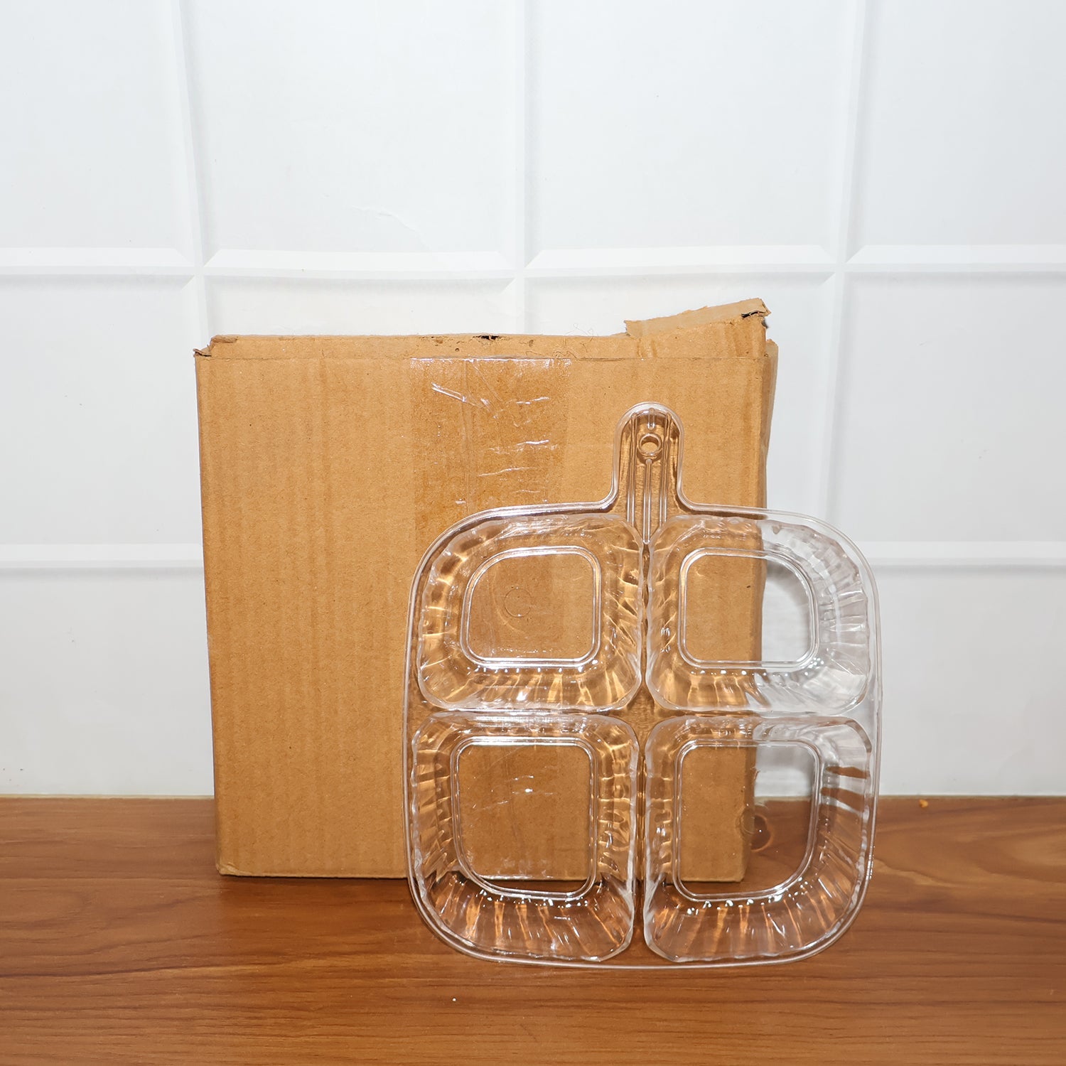 Clear plastic serving tray in kitchen setting