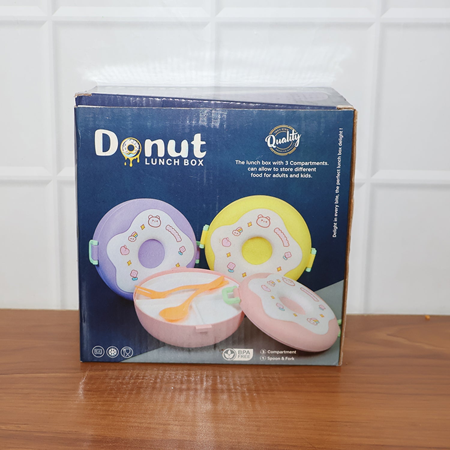 Donut Lunch Box in hand, demonstrating portability
