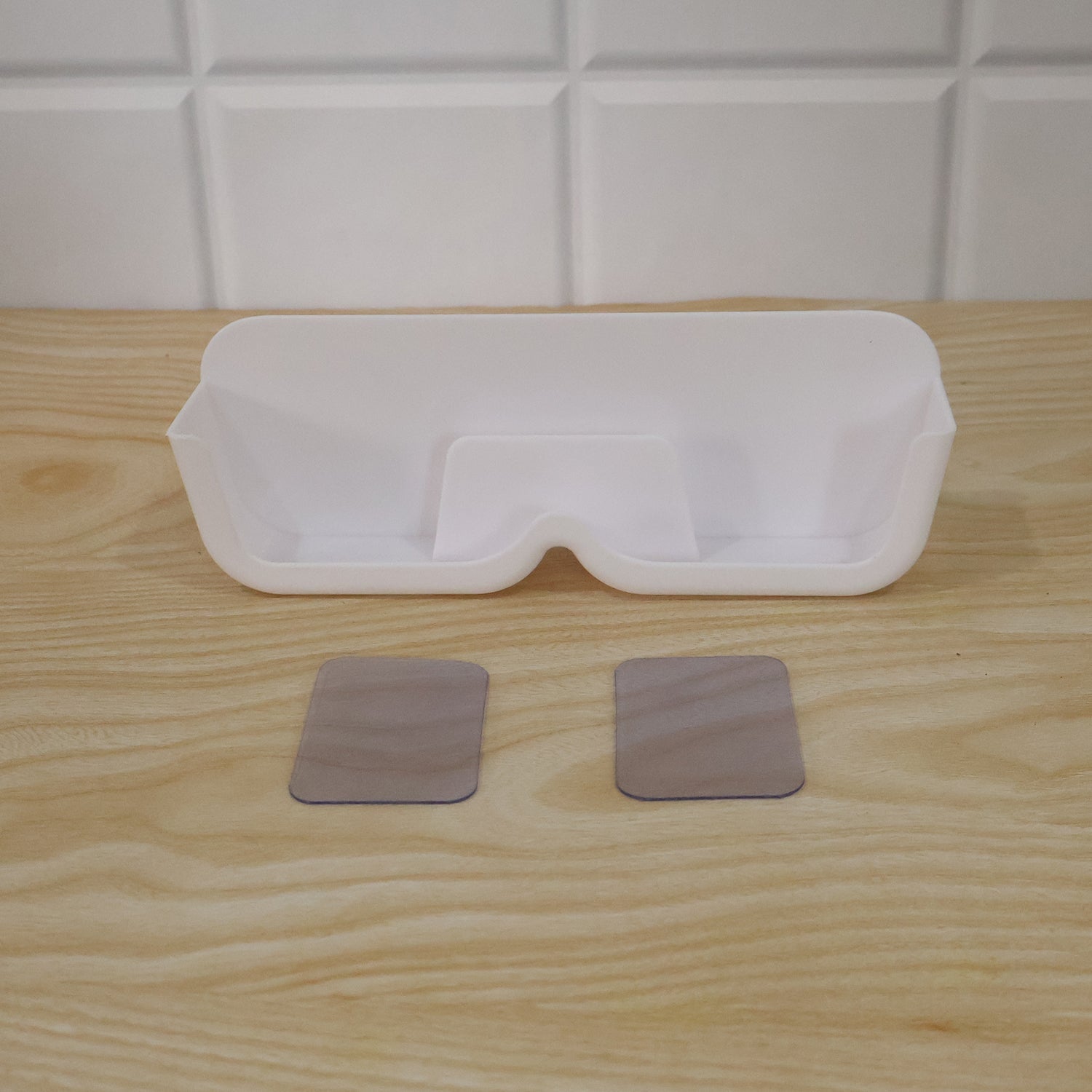 Live photo of plastic sunglasses holder stand