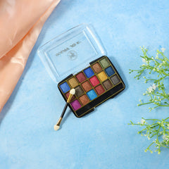 Close-up of shimmer pink and purple eyeshadow shades in palette