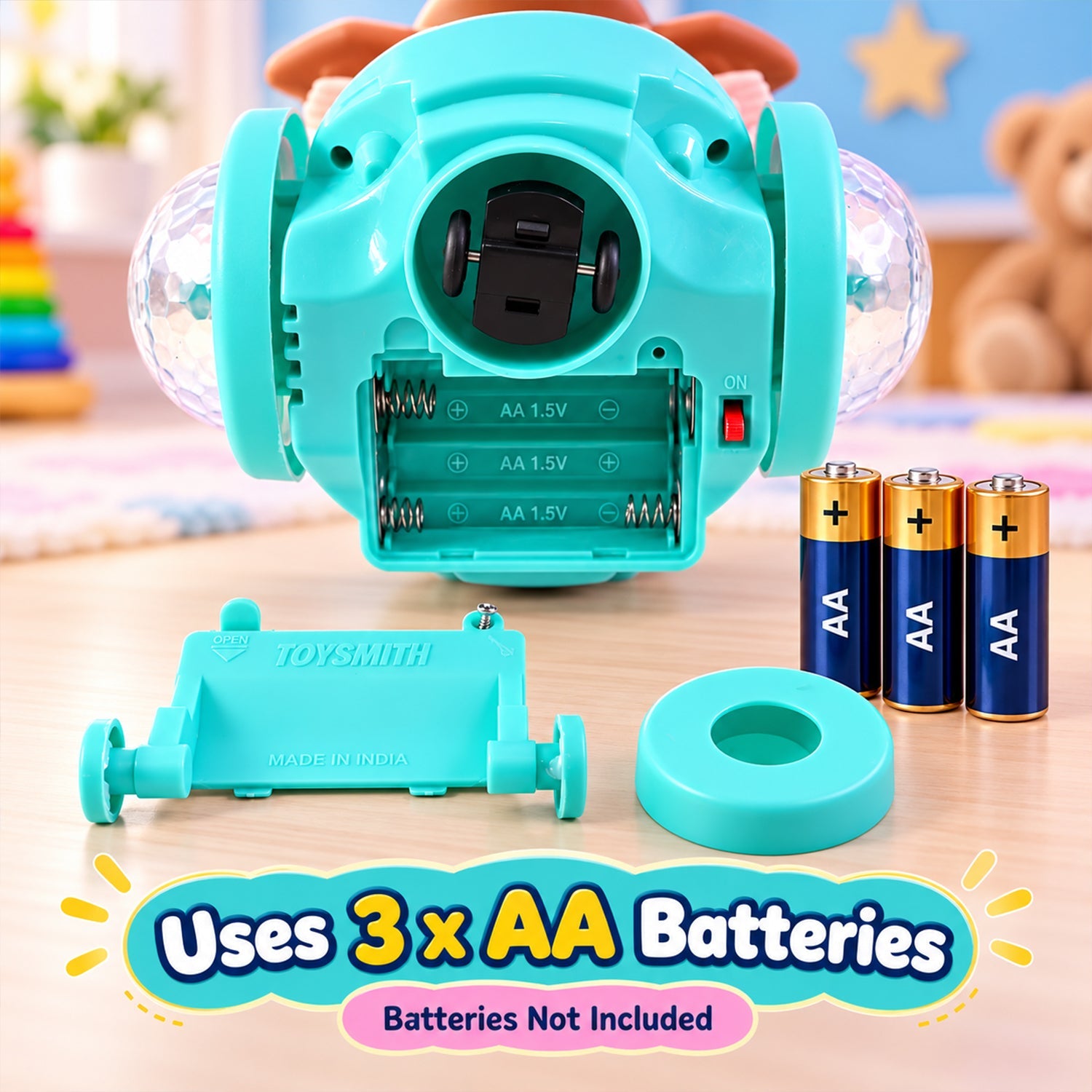 The underside of a teal dancing doll toy shows the battery compartment for three AA batteries, which are placed next to it.