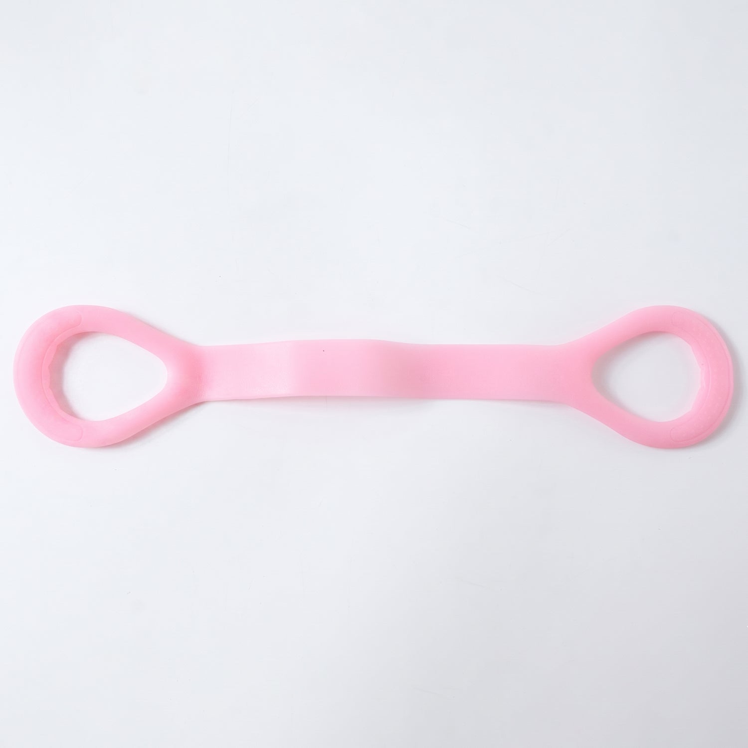 Woman using a silicone resistance band for arm exercises