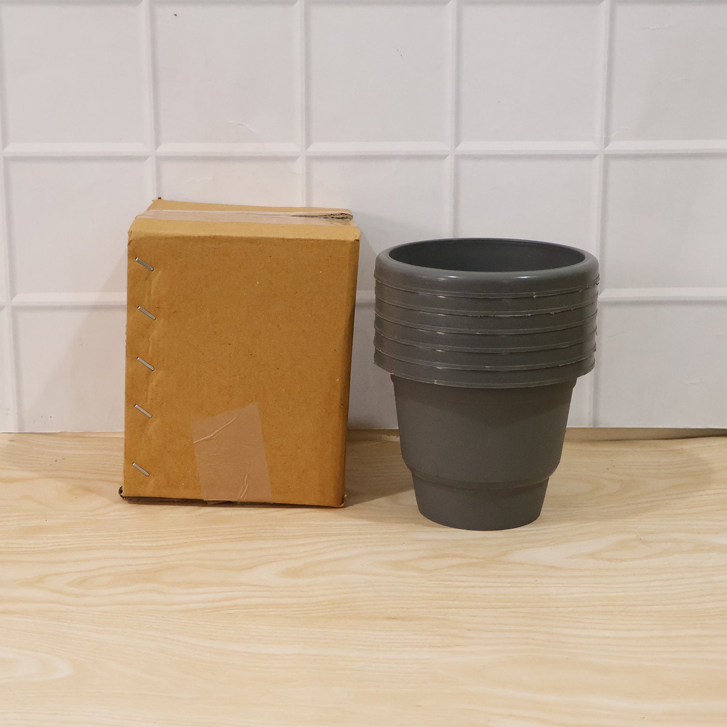 Set of plastic planters with assorted colors for home garden