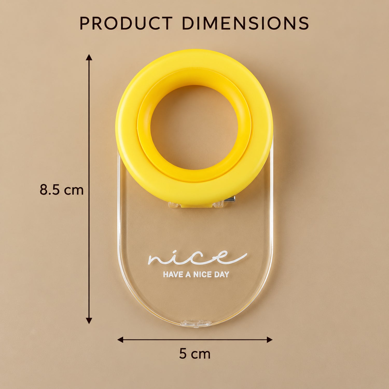 Overhead view of the yellow ring and clear base toilet seat lifter with dimensions 8.5 cm by 5 cm.