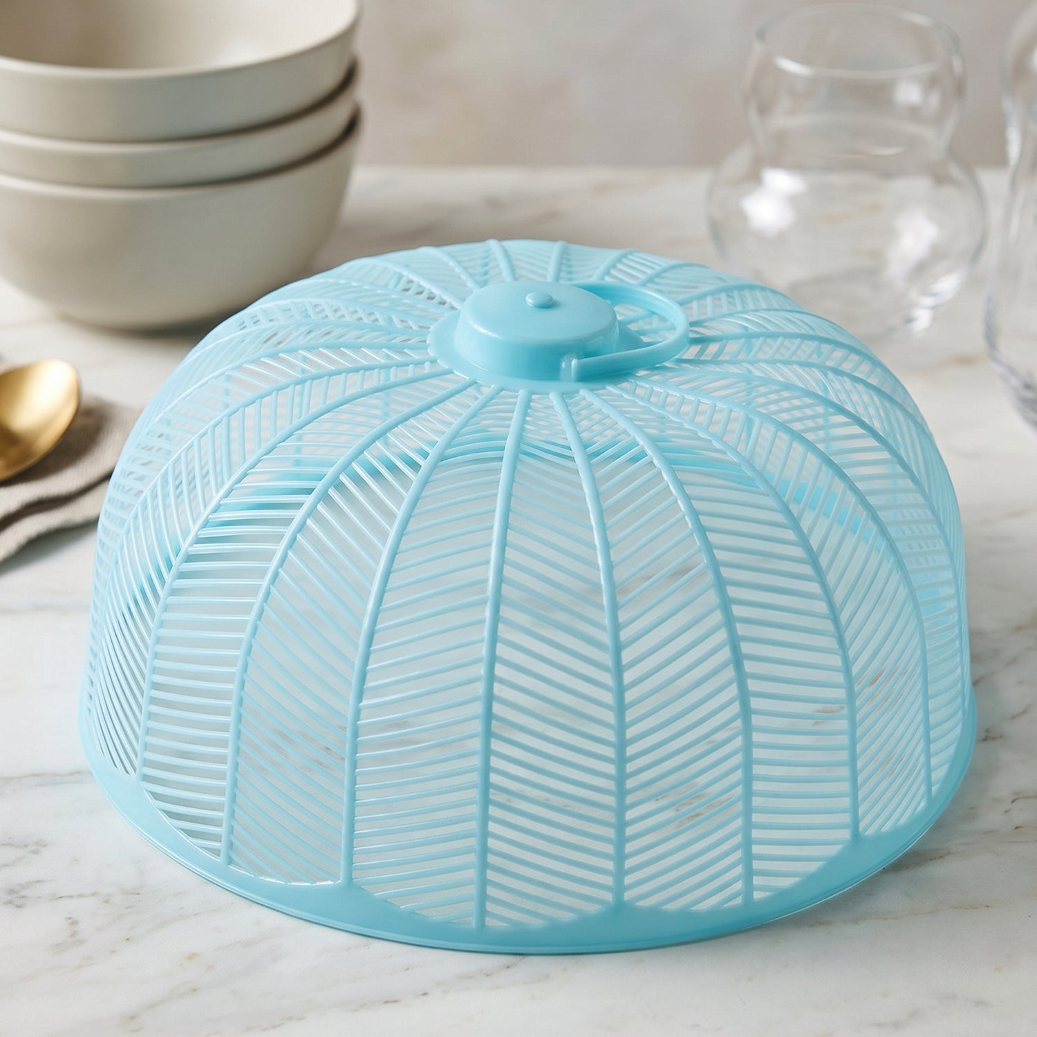 Food cover shown from the side with handle on top