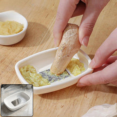 Stainless steel grinding teeth of garlic ginger grater plate in a kitchen setting
