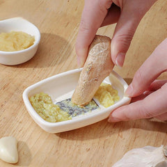 Side view of the garlic ginger grater plate demonstrating its rectangular shape