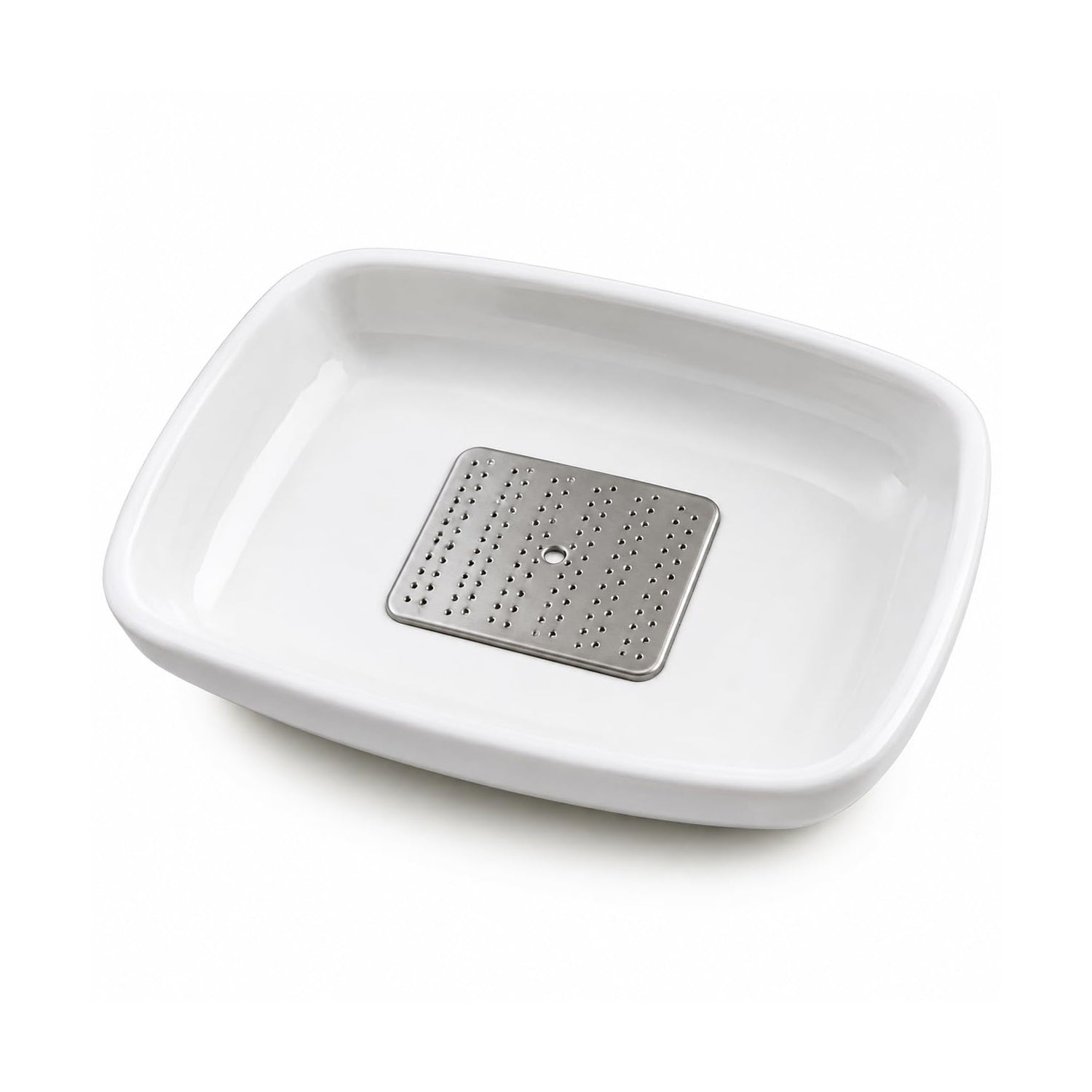 The garlic ginger grater plate in use, grating ginger over a dish