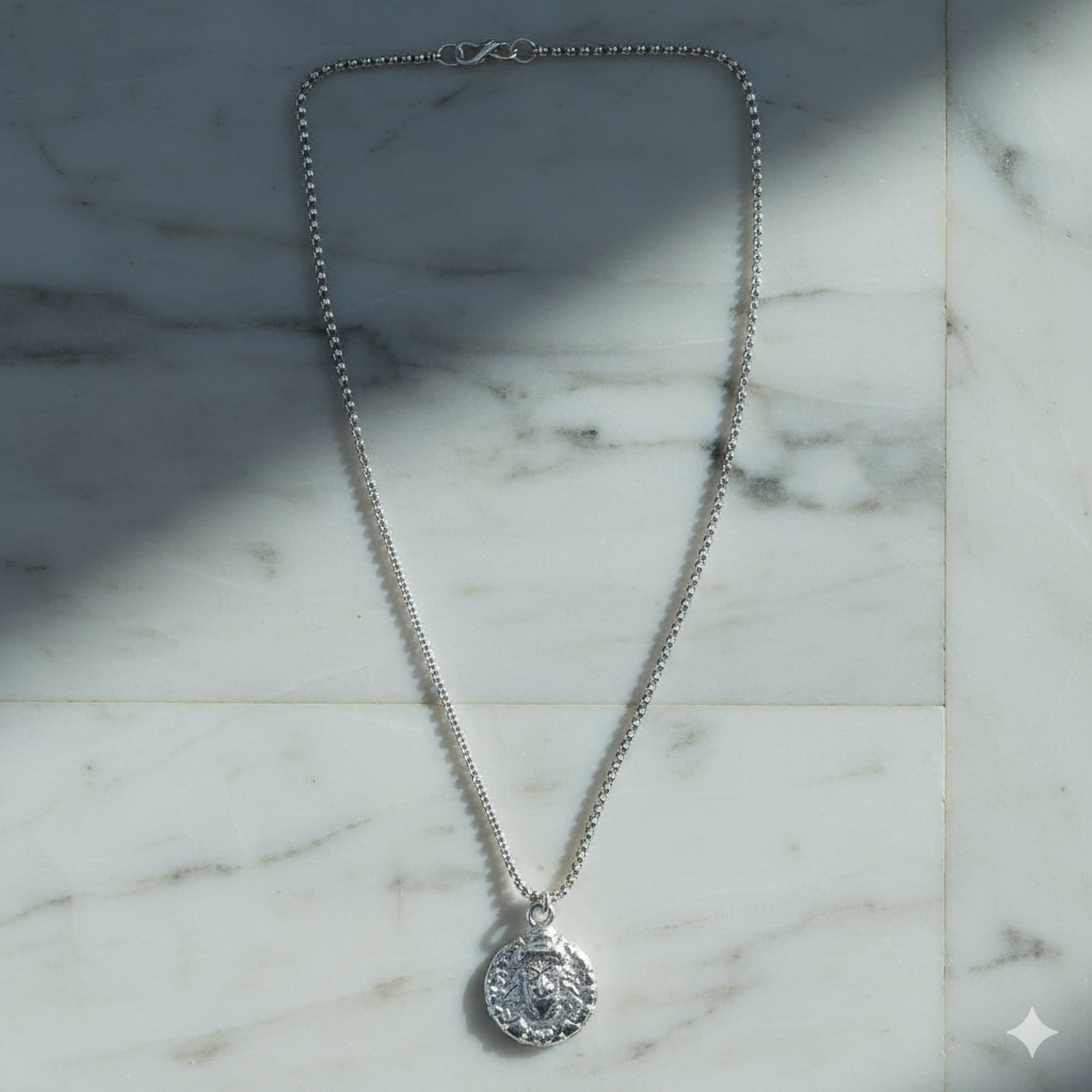 Hanuman locket pendant necklace arranged on flat surface